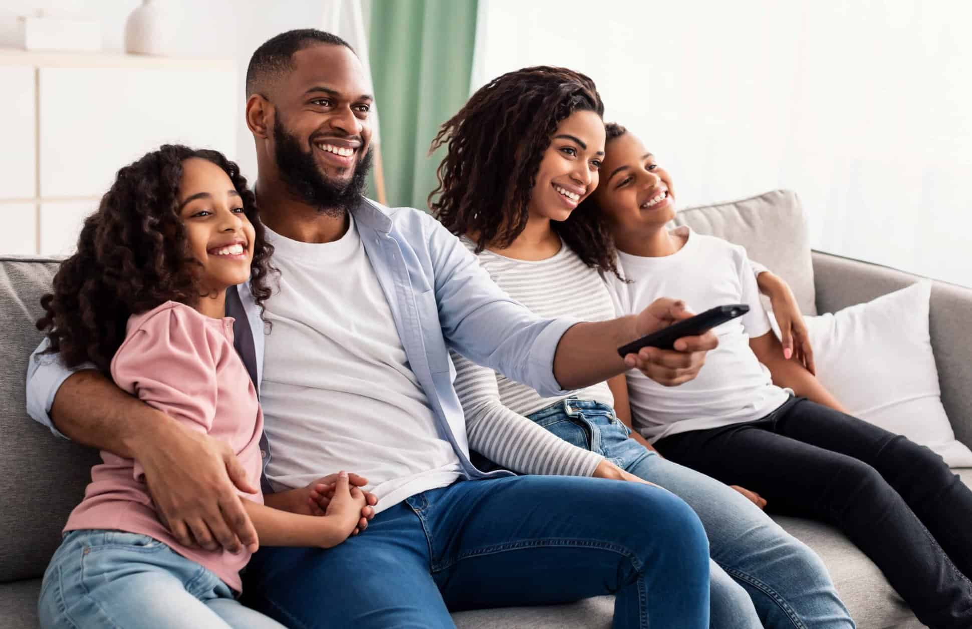 happy young black family watching television sitti lossy scaled